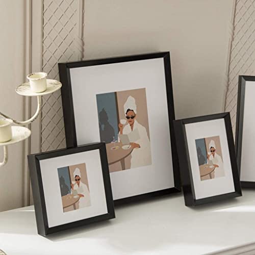 Decoración de marcos fotográficos de aluminio negro para crear una galería de arte en tu salón 4