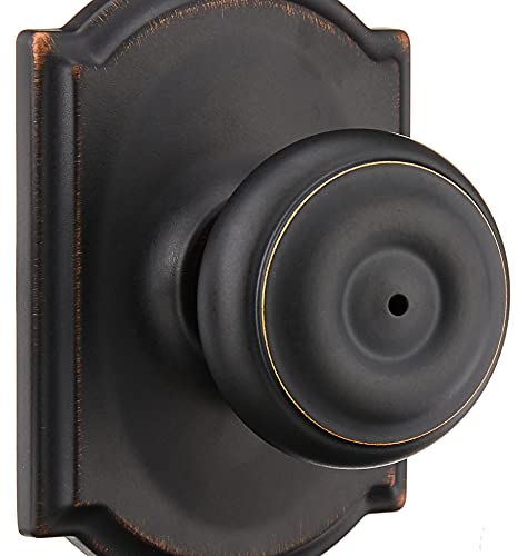 Image of SCHLAGE F40 GEO 716 CAM Georgian Door Knob with Camelot Trim, Bed & Bath Privacy Lock, Aged Bronze (Pack of 2)