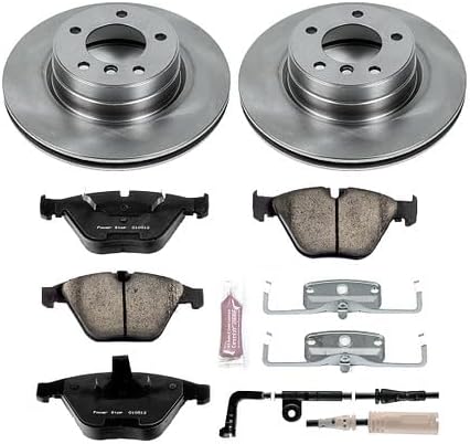 Detailed view of Power Stop brake kit components including two rotors, four brake pads, and various hardware pieces.