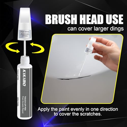 Applying Tesla touch up paint with brush