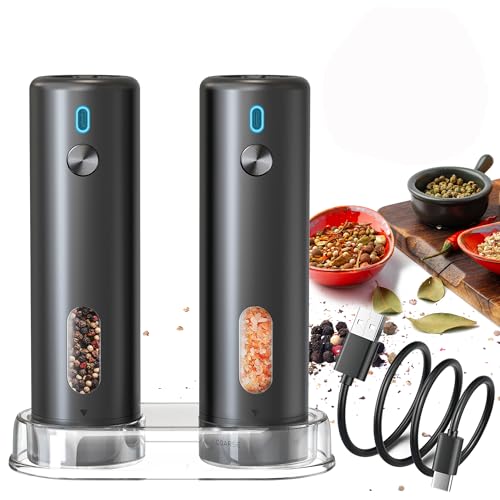Electric salt and pepper grinder set with automatic operation, featuring a sleek design, transparent spice compartments, and USB charging, alongside assorted spices in bowls on a wooden cutting board.