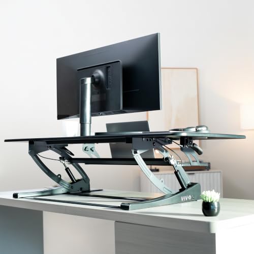 Image of VIVO 54 inch Manual Height Adjustable Large Standing Desk Converter, Quick Sit-Stand Desk Riser, Tabletop Pneumatic Assist Height Adjust 6.5 to 17 inch, Black, DESK-V054V
