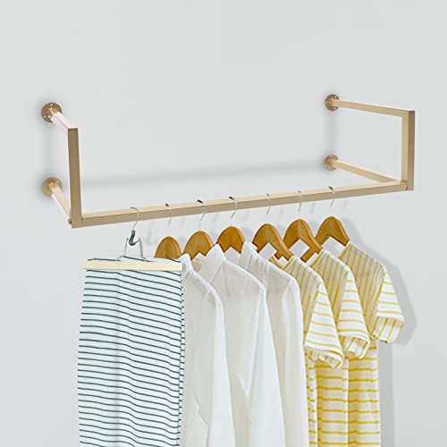 Porte-vêtements en métal doré pour optimiser le dressing d'une chambre moderne