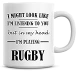 ** Impreso en ambos lados. Taza de café con texto en inglés \"I Might Look Like I\'m Listening To You but In My Head I\'m Play Rugby