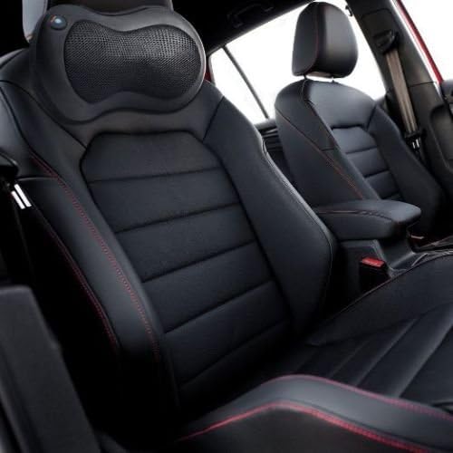 Massager secured to a car seat back.