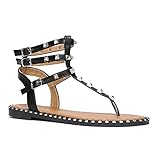 Nu-pieds en matière synthétique inspiration style spartiates.Brides cloutées dotées de boucles ajustables.Semelle entourée de petits clous. Hauteur du talon : 1,5 cm.