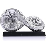 Complète différents styles d'intérieur : cet objet décoratif abstrait se marie sans effort avec les styles modernes, minimalistes et du milieu du siècle. Sa finition argentée et son design unique le rendent idéal pour la décoration d'étagère argentée, la décoration de table basse et les objets décoratifs d'étagère, rehaussant l'esthétique de votre maison