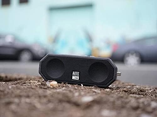 Altec Lansing LifeJacket H2O 4 speaker on the ground with cars in the background