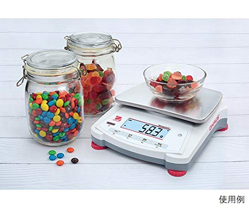 Ohaus NV422JP Compact Electronic Balance weighing a bowl of colorful candies, displaying '58.3 g'.