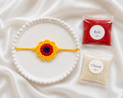 Image of Handmade Crochet Flower Rakhi for Kids, Red and Yellow, Cotton Yarn, Adjustable Knot, with Roli and Chawal, Raksha Bandhan