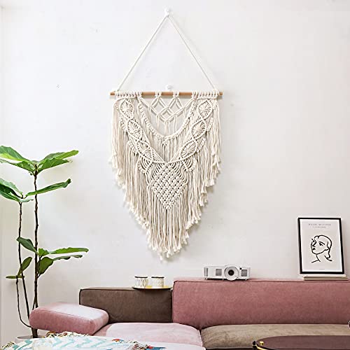 Tapisserie tissée main avec pompons pour une décoration murale raffinée