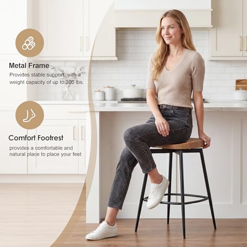 Image of 25 inch Swivel Backless Saddle Bar Stools Set of 2, Walnut | Solid Wood Saddle Seat with Metal Legs, Footrests and Non-Marking Feet for Kitchen Island