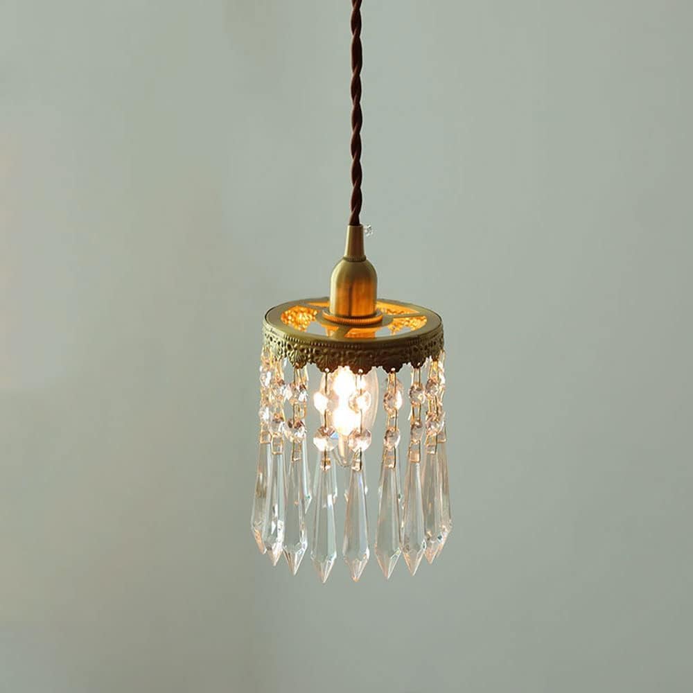 Lámpara de cristal dorada regulable para iluminar tu mesa de comedor 7