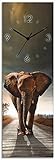wanduhr motiv katze Künstler: Carlos Caetano I Motiv: Ein Elefant läuft auf einer Straße mit der Sonne im Rücken Landschaft Afrika Schatten Wald Baum Savanne