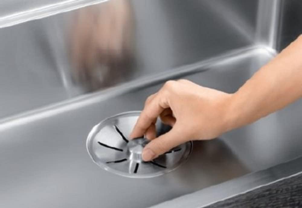 Hand operating BLANCO InFino strainer basket