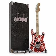 CRAFTED WITH PRECISION: This 10in/25cm wooden Miniature guitar with plastic and metal details includes a display stand, making it perfect for showcasing. Each order contains a handmade mini guitar, stand, display box, and artist name plate with 2 acr...