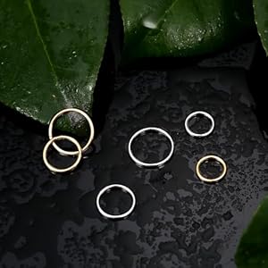 Neuspiercing in chirurgisch staal-witte prongsetting kristal met een kromming - Evy's Secrets Neuspiercing in chirurgisch staal-witte prongsetting kristal met een kromming - Evy's Secrets