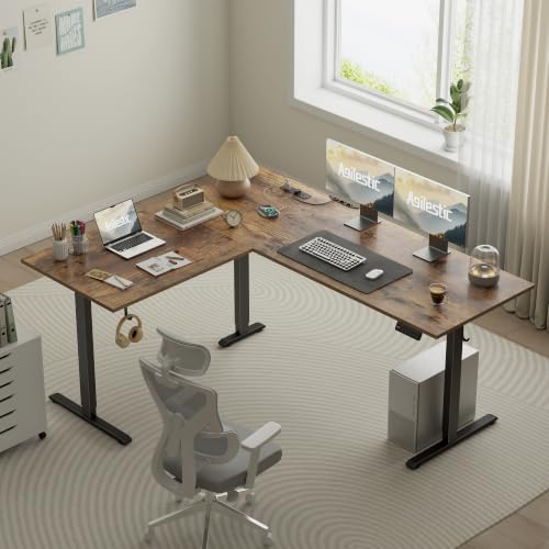 Image of 63 Inch L Shaped Electric Standing Desk, Corner Workstation, Rustic Brown | 3 AC outlets, 2 USB ports, cable tray, cord clips, 3 memory presets, anti-collision and 176 lb capacity for home office.