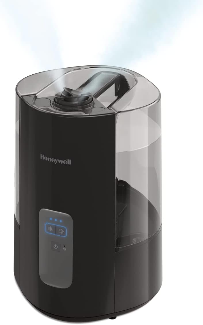 The base unit of the Honeywell HWC775B humidifier with the water tank removed, showing the internal components for cleaning.