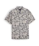 Chemise manches courtes imprimée lin GRIN. Chemise manches courtes col italien avec pied de col, imprimé allover, rehausse dos, broderie 4flo sur la poitrine, coton-lin 135g/m² délavé pour plus de douceur.. Notre mannequin studio mesure 1m85 et porte une taille L.