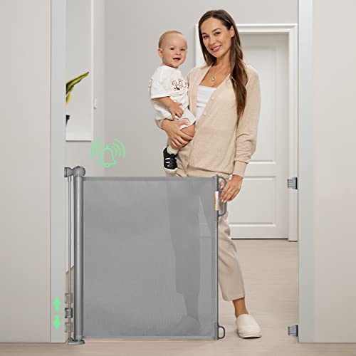 Image of Momcozy Retractable Baby Gate, Alarm Mesh Baby Gate or Mesh Dog Gate, 33 inches high, extends to 55 inches Wide, Child Safety gate for doorways, Stairs, hallways, Indoor/Outdoor.