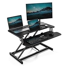 ENHANCED ERGONOMICS: Increase WFH productivity with the VonHaus standing desk converter. With a large W80 x D40cm top, tablet slot, and keyboard shelf, create your optimal setup with ease. EASY ADJUSTMENTS: Effortlessly bring your screens to eye leve...