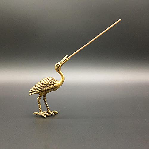 Figurine grue en cuivre pour décorer un salon de thé zen