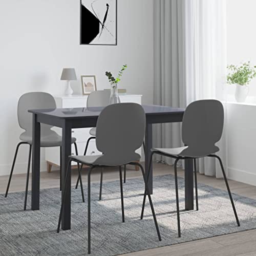 Table à manger noire peu encombrante pour optimiser votre salon