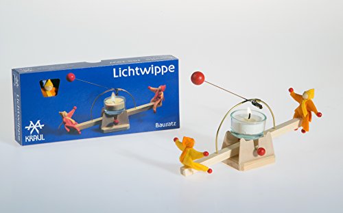 Lichtwippe die Feuerschaukel von Kraul mit gelb-orangenen Püppchen Cover