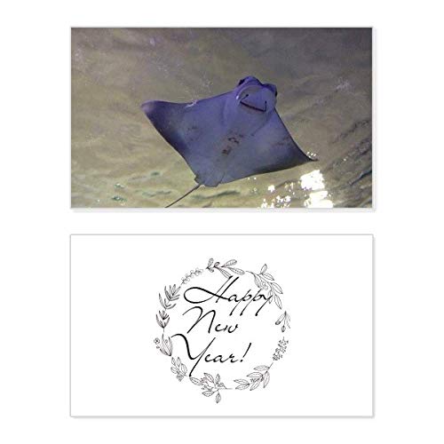 Tarjeta de Año Nuevo de raya marina con mensaje de bendición y foto de ciencias naturales
