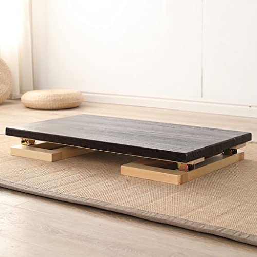 Table basse pliable bois marron pour optimiser un studio