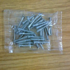 Carpet cover plate door threshold screws in chrome finish to match chrome carpet bars