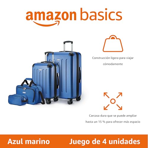 Juego de equipaje de cuatro unidades de Amazon Basics en azul marino, resaltando su construcción ligera y capacidad ampliable