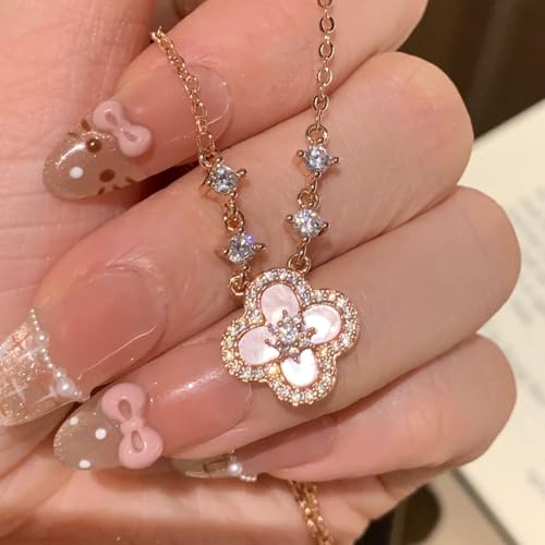 Collier de fleurs à quatre feuilles rose et son bracelet haut de gamme en parure de luxe léger