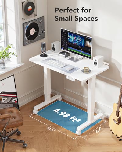 Image of HUANUO Electric Small Standing Desk, Whole Piece Desktop, Adjustable Height Computer Desk, 4 Height Memory Settings, Sit Stand Up Desk for Home Office, 35 inch x 24 inch, White