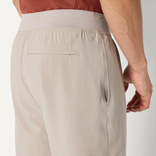 Image of Amazon Essentials Men's Athletic Running Training Shorts, Performance Stretch Woven Workout Shorts, 7 inch