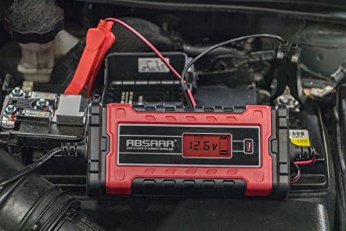 Absaar Evo 8.0 Battery Charger connected to a car battery in an engine bay