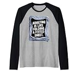 Adultar es como doblar una sábana Camiseta Manga Raglan