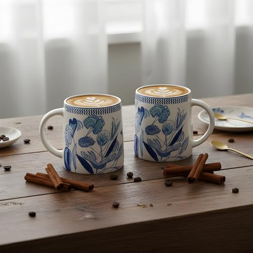 Image of Miah IndigoBloom Ceramic Cup Set - Set of 2 | 10.16 cm x 6.85 cm x 8.89 cm | Handcrafted Coffee & Tea Mugs | Microwave & Dishwasher Safe | Elegant Blue Floral Design