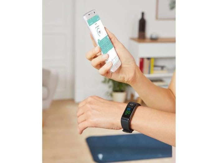 User interacting with the activity tracker and a smartphone app