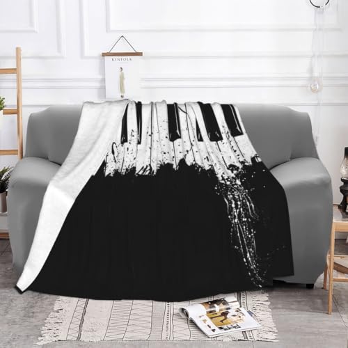 Couverture en flanelle piano 200x150 cm douce et chaude pour canapé