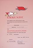  Urkunde Bestenabzeichen der Kampfgruppen der Arbeiterklassen in Gold inkl. Abzeichen