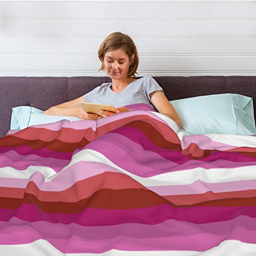 Couverture arc-en-ciel en peluche pour cocooning sur le canapé