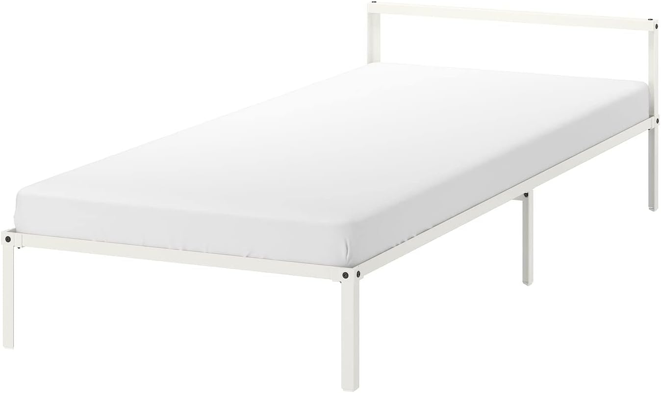 White IKEA GRIMSBU bed frame with a white mattress, viewed from an angle.
