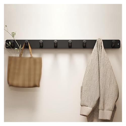 Ganchos de madera para abrigos que evitan ropa tirada en la entrada