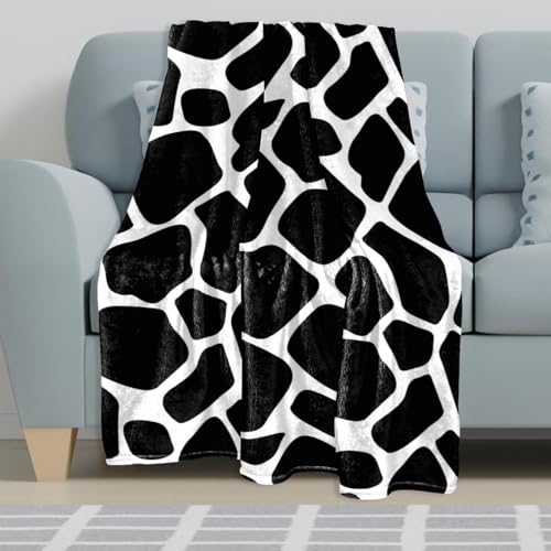 Couverture microfibre vache pour des soirées cocooning sur le canapé