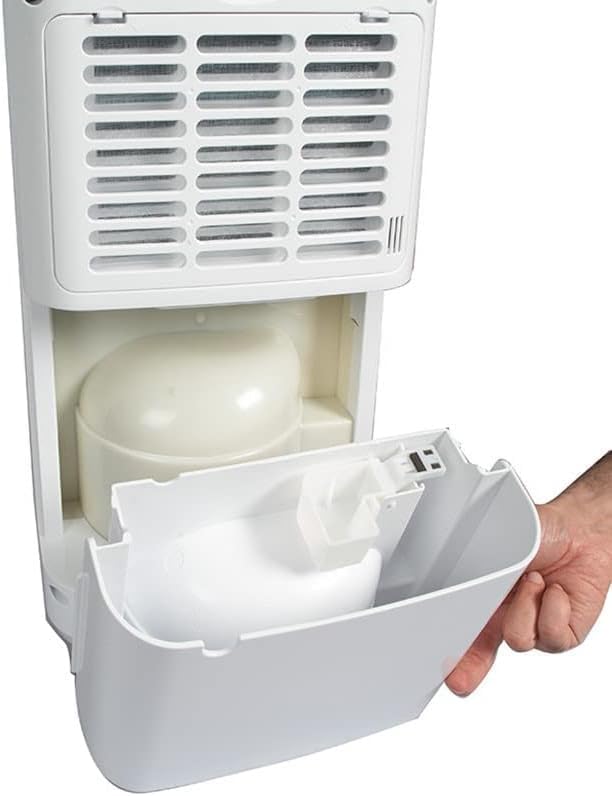 Hand removing the water tank from the Habitex H1000 Dehumidifier