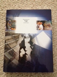 Paperback Macroeconomics, 9th edition Book
