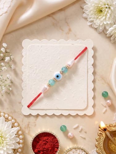 Image of Karatcart Stylish Light Blue Beads Evil Eye Handmade Rakhi for Brother with Roli & Chawal