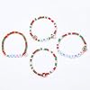 Seraphina 4PCS Christmas Clay Beaded Bracelets - Stackable Stretch Bracelets with Joy Merry Christmas Letter Beads & Snowman/Reindeer Charms - Christmas Jewelry Gift Set